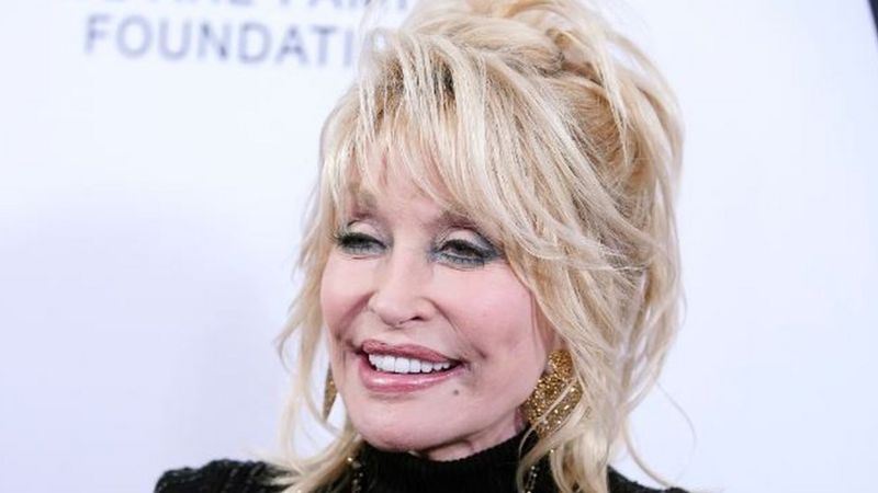 How Dolly Parton is ‘Playing an Important Role in Covid  Battle